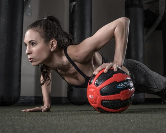Amy uses a 6 lb. Hero Strength Medicine Ball to up the ante on the basic plank.