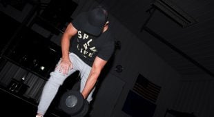 Athlete lifting a Hampton Gel-Grip Dumbbell off the gym floor.