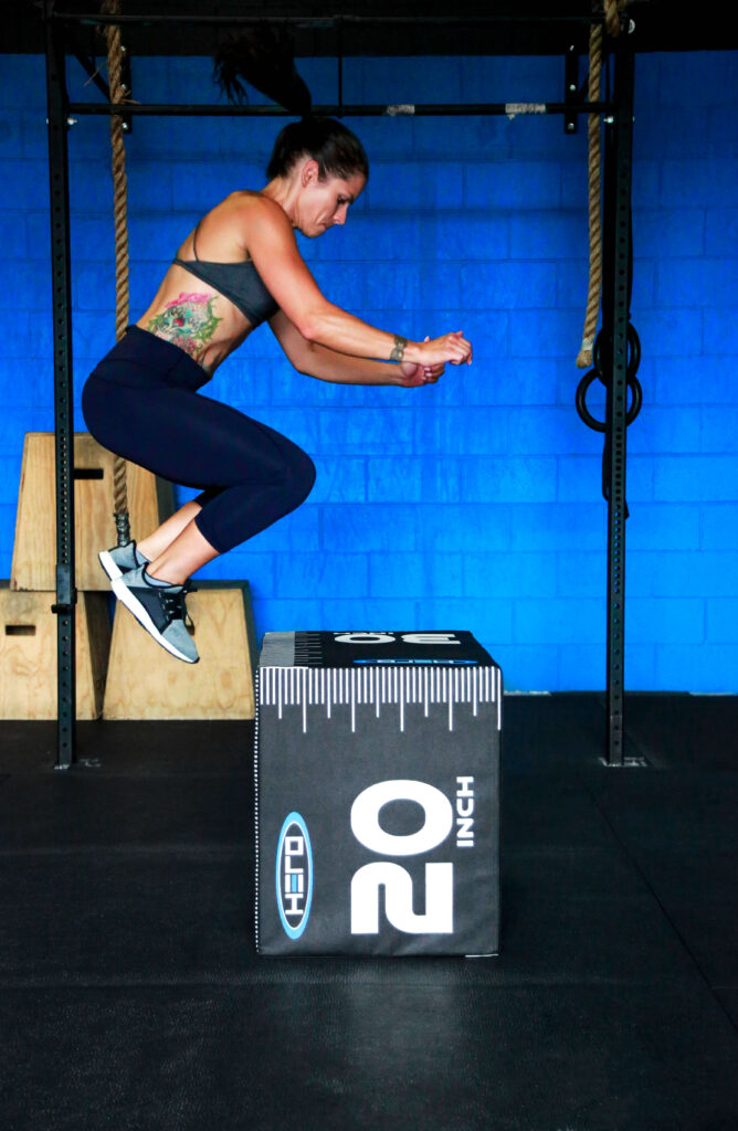 female athlete on a jumpbox