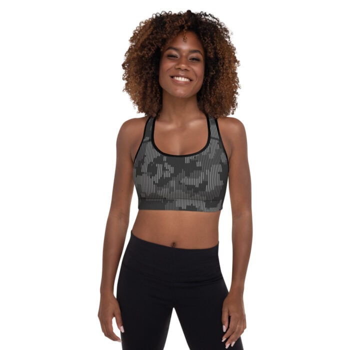 African American woman with short natural hair, facing camera, shades of gray camo racerback sports bra with black leggings