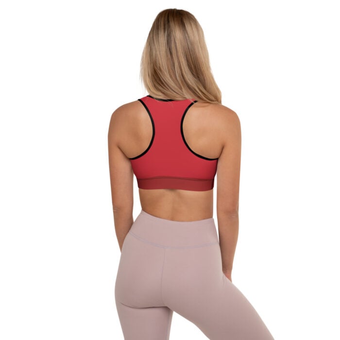 back of blonde woman in red racerback tank with muted mauve leggings