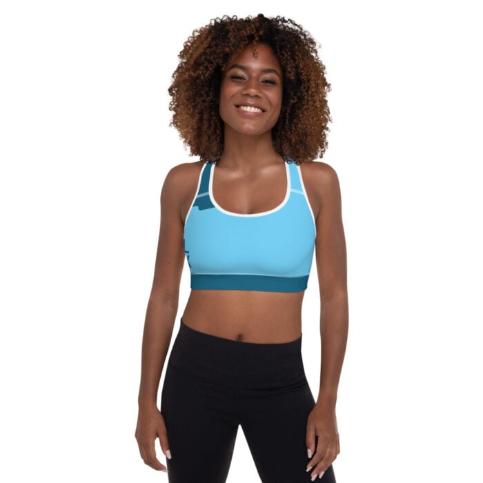 African American woman back facing camera with short natural hair blue racerback sports bra and black leggings