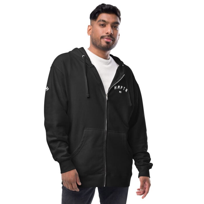 male modeling black zip up hoodie with white hampton logo on the chest
