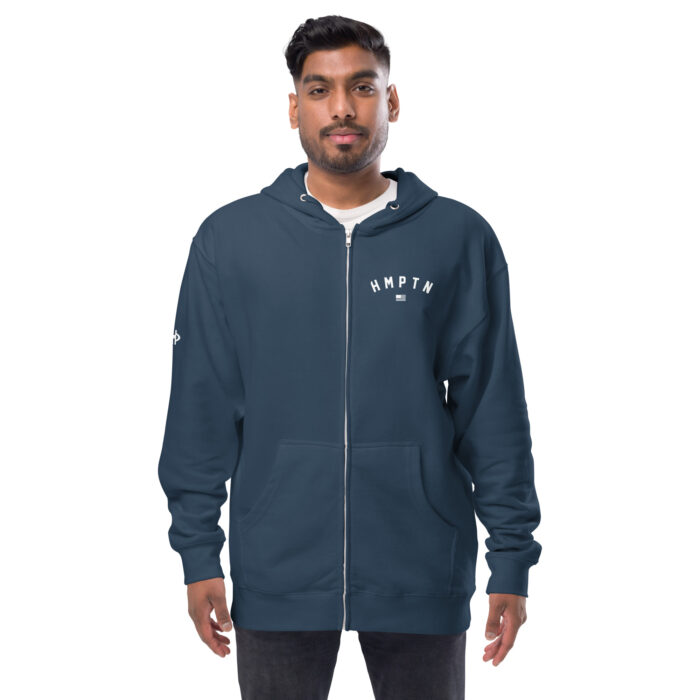 male modeling navy zip up hoodie with white hampton logo on the chest