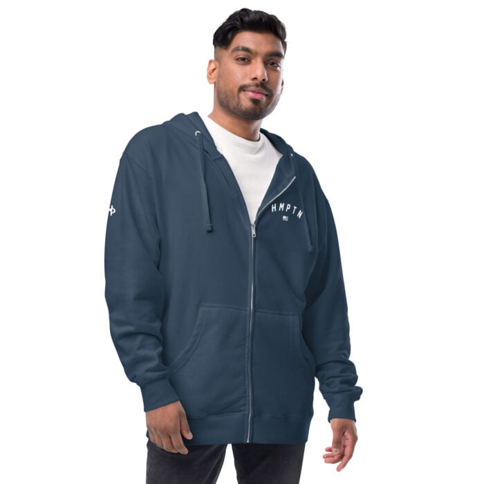 male modeling navy zip up hoodie with white hampton chest logo
