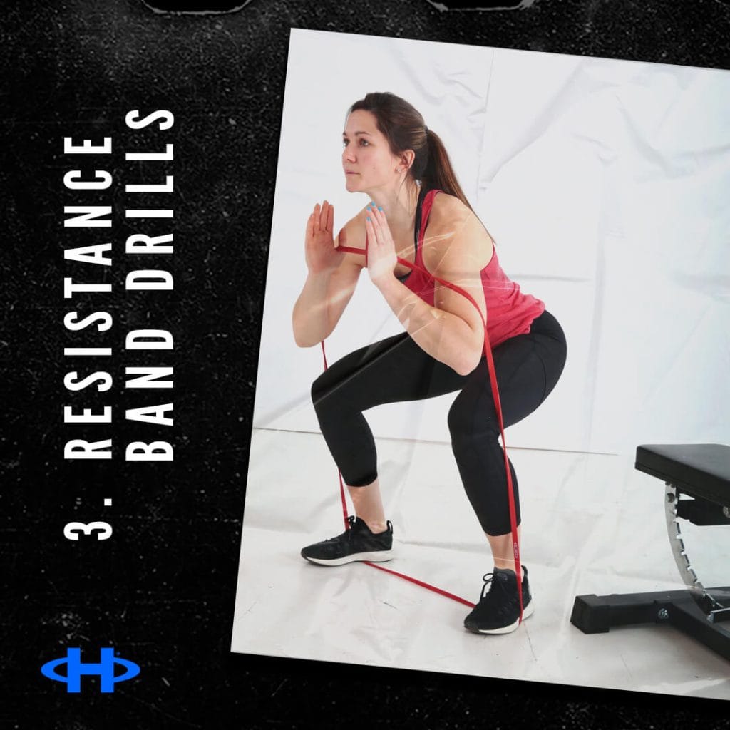 Woman using resistance bands to do a squat.